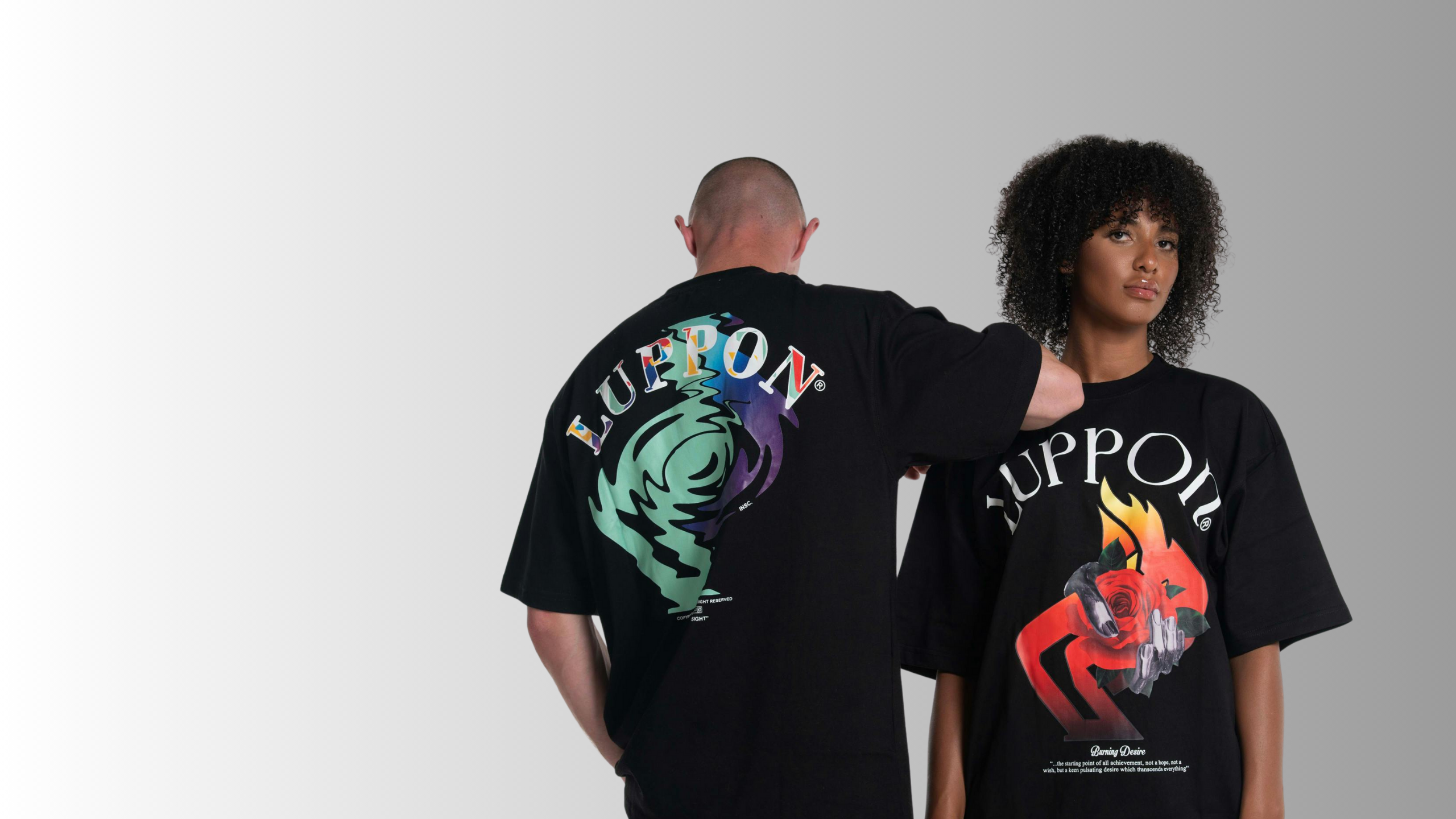 Two people wearing black t-shirts with colorful designs and 'LUPON' branding on a white background.
